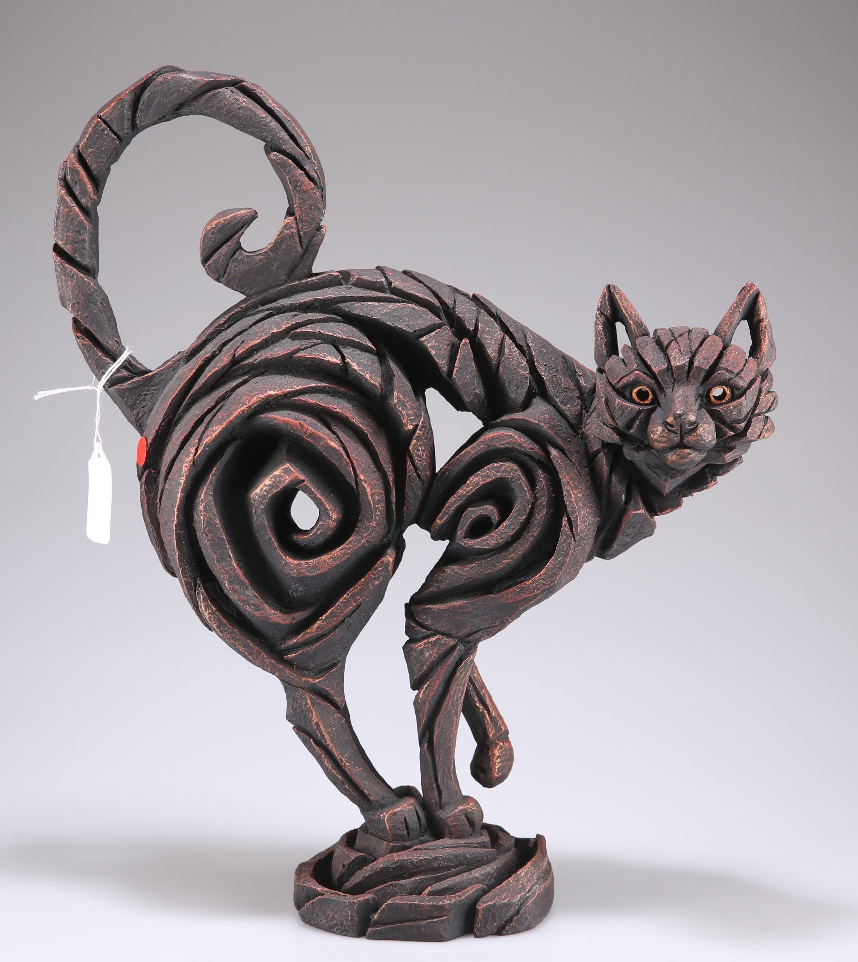 A modern resin sculpture of a cat, 40cm high overall