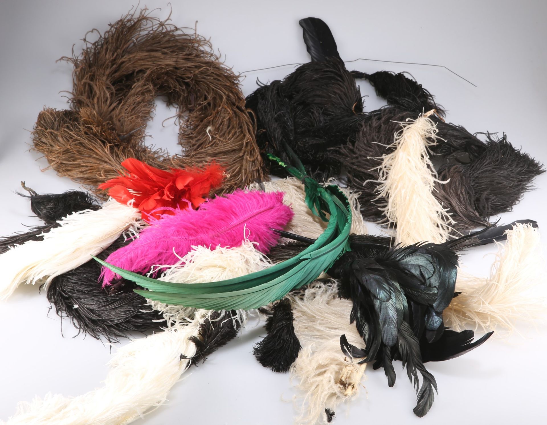 A box of assorted coloured and natural ostrich and other millinery feathers