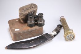 A kukri, binoculars, brass torch and tin of clays pipes (4)