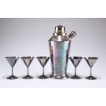 A silver-plated cocktail shaker and five glasses