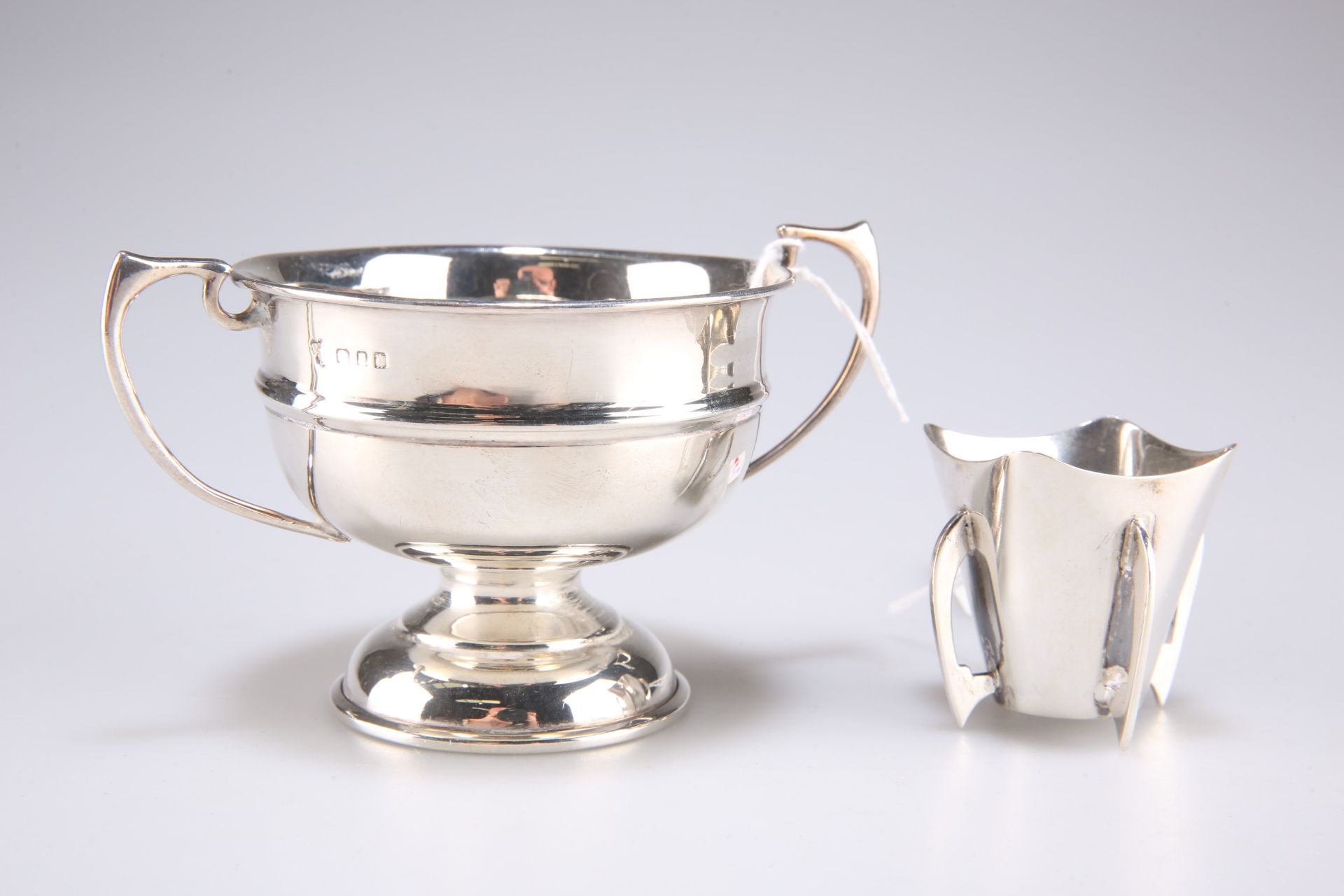 A small silver presentation bowl and vase