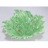 A Continental green glazed pottery leaf dish, 32cm