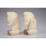 A pair of onyx bookends, 13cm high