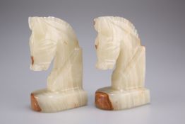 A pair of onyx bookends, 13cm high