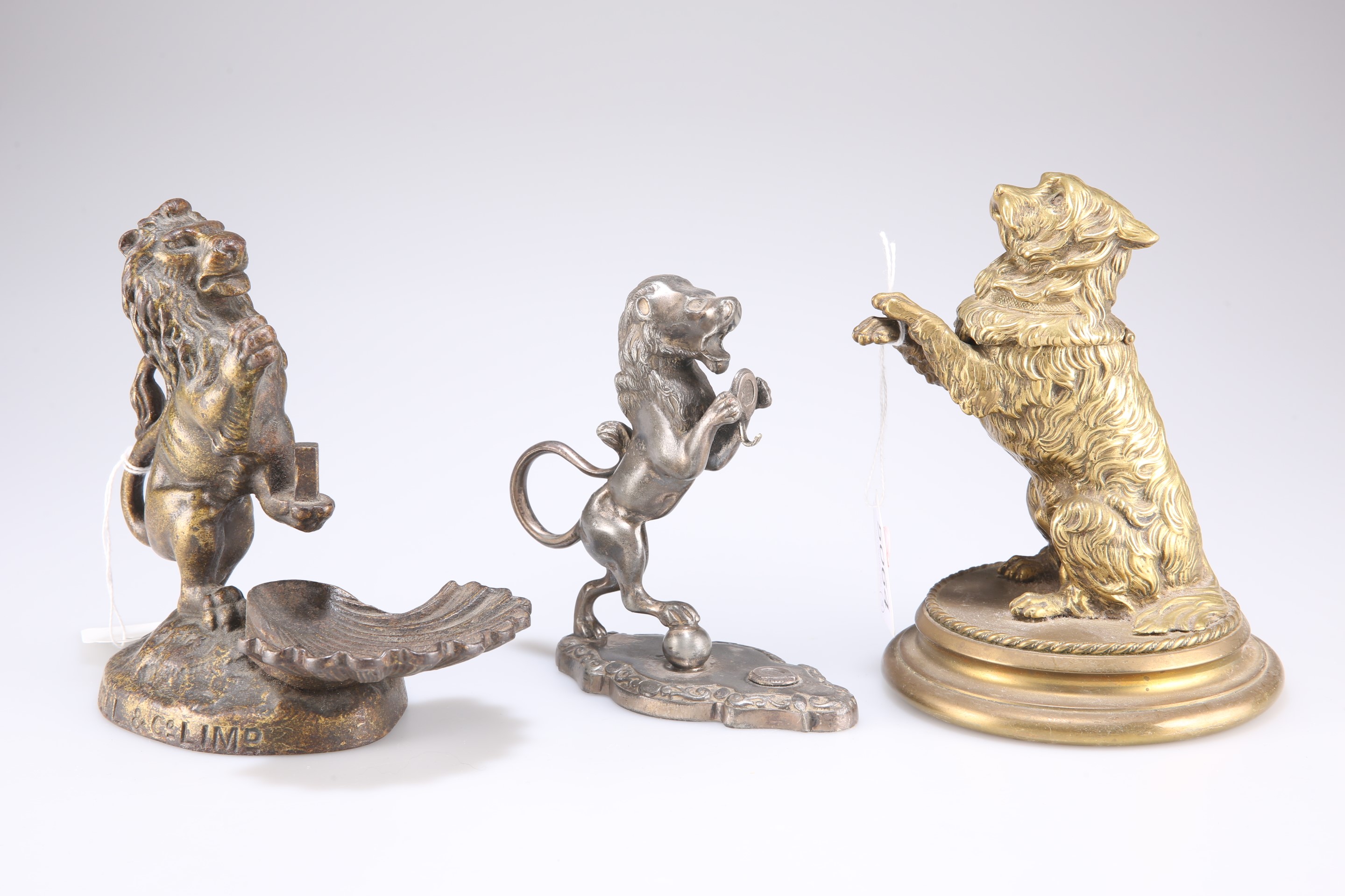 A Victorian cast brass novelty inkwell in the form of a begging dog, etc.