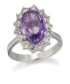 AN 18 CARAT WHITE GOLD AMETHYST AND DIAMOND CLUSTER RING