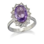 AN 18 CARAT WHITE GOLD AMETHYST AND DIAMOND CLUSTER RING