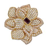 A GARNET AND DIAMOND FLOWER BROOCH