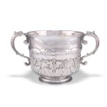 A CHARLES II SILVER TWO-HANDLED PORRINGER