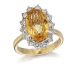 AN 18 CARAT GOLD CITRINE AND DIAMOND CLUSTER RING