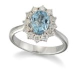 AN 18 CARAT WHITE GOLD AQUAMARINE AND DIAMOND CLUSTER RING