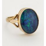 A 9 CARAT GOLD COMPOSITE BLACK OPAL RING