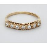 A 9 CARAT GOLD DIAMOND HALF HOOP RING