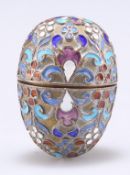 A RUSSIAN SILVER AND ENAMEL EGG