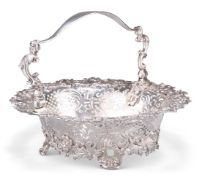 A GEORGE II ROCOCO SILVER CAKE BASKET