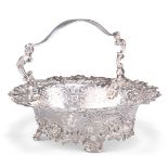 A GEORGE II ROCOCO SILVER CAKE BASKET