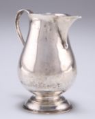 A GEORGE II SILVER CREAM JUG