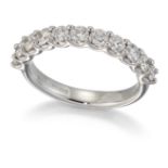 AN 18 CARAT WHITE GOLD DIAMOND HALF HOOP RING