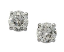 A PAIR OF SOLITAIRE DIAMOND EARRINGS