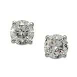 A PAIR OF SOLITAIRE DIAMOND EARRINGS