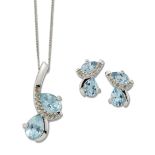 A 9 CARAT WHITE GOLD BLUE TOPAZ AND DIAMOND PENDANT ON CHAIN AND EARRING SET