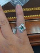 Platinum ladys custom diamond and emerald ring