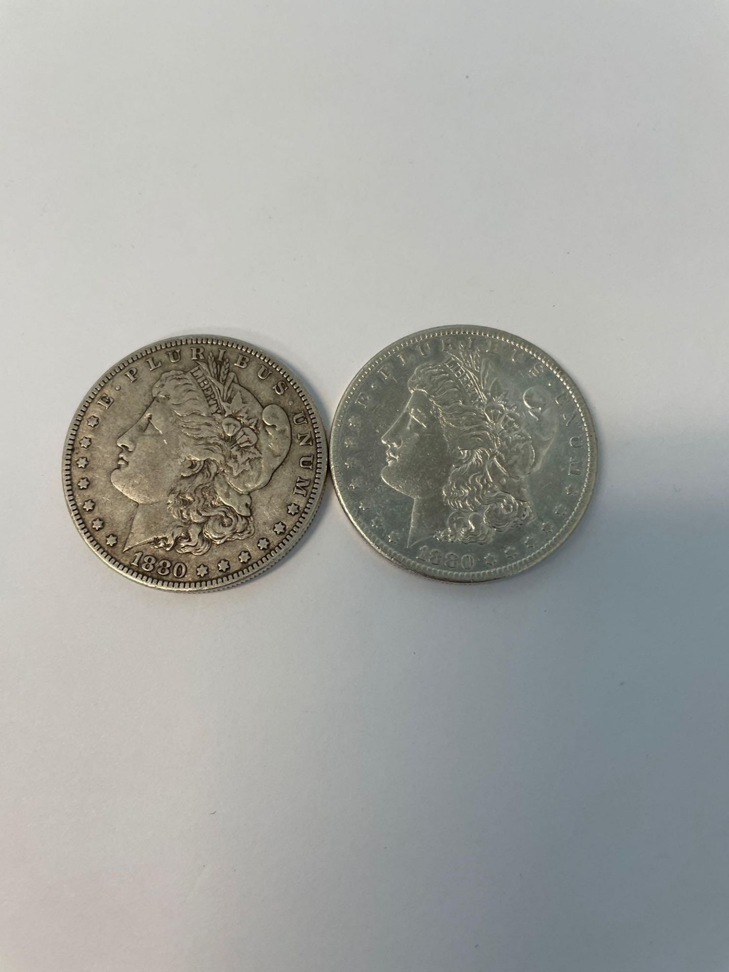 (2) 1880 Morgan Silver Dollars