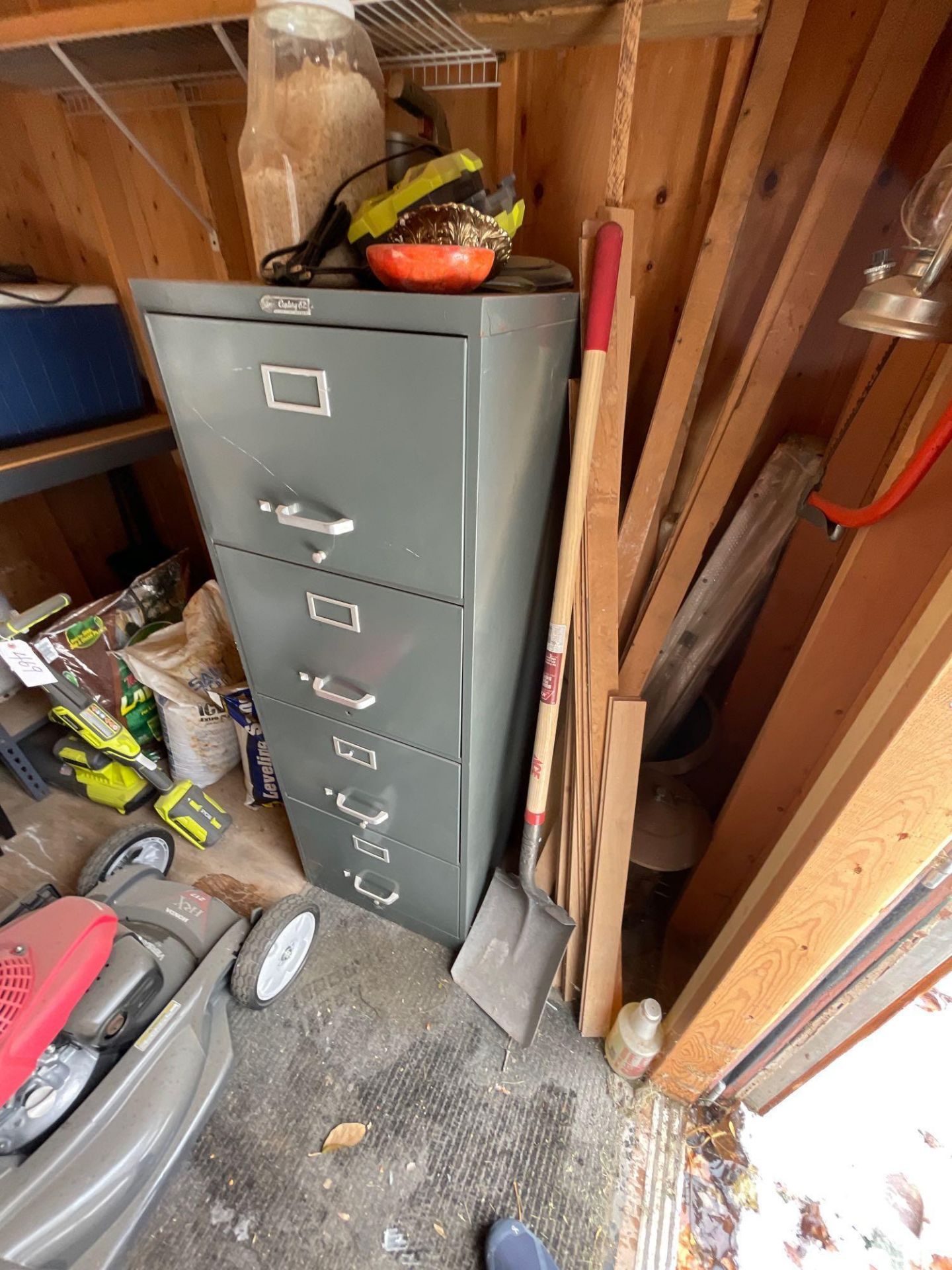 contents of shed (file cabinet, side table, cooler, Scotts seed, hoses, shovel etc)