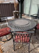 round fire table and four chairs