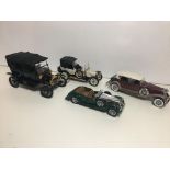 Four Franklin mint fine detail model car models.