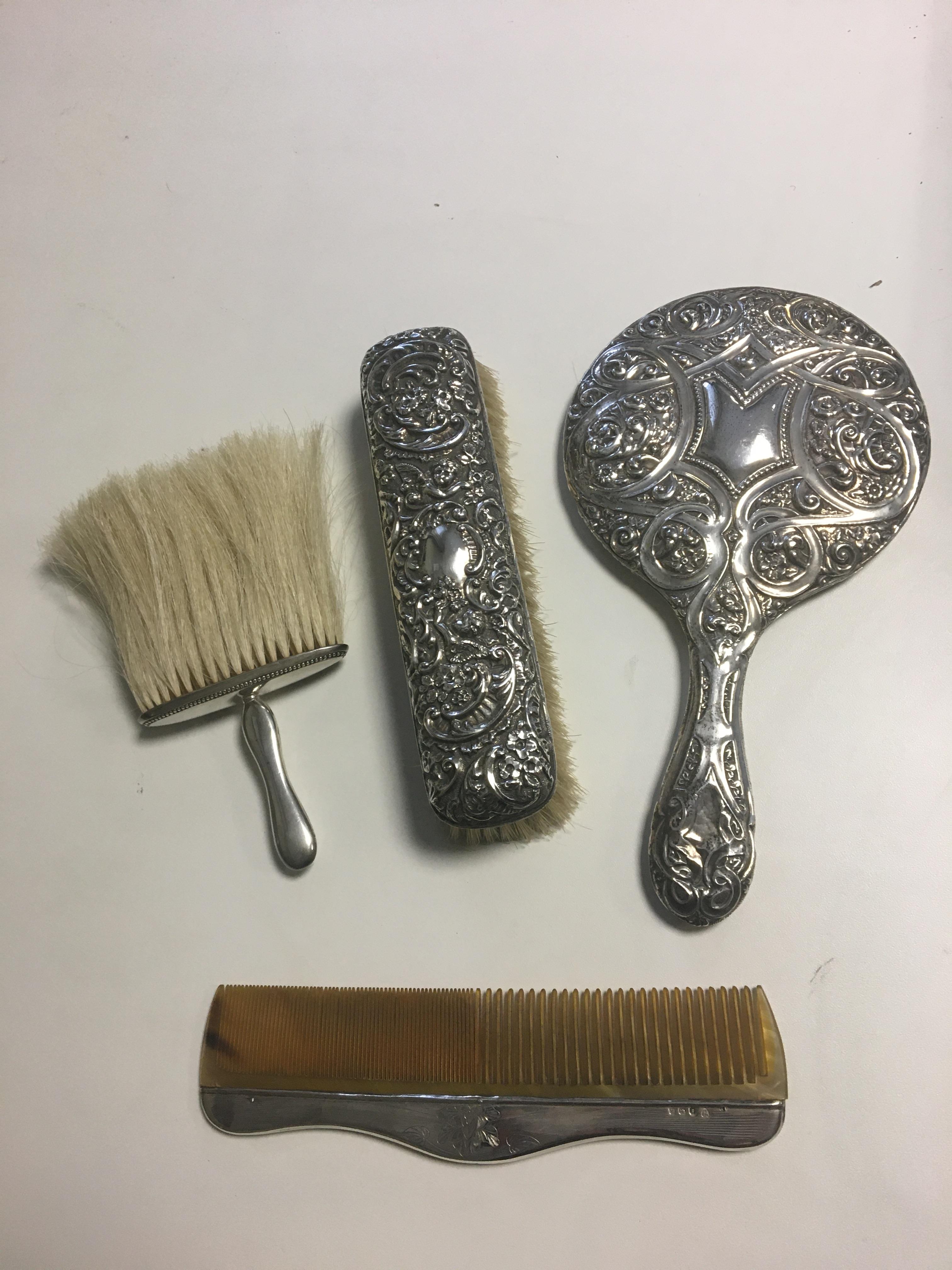 HM Silver brushes, mirror and comb.