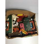 Box of vintage trains and rolling stock.