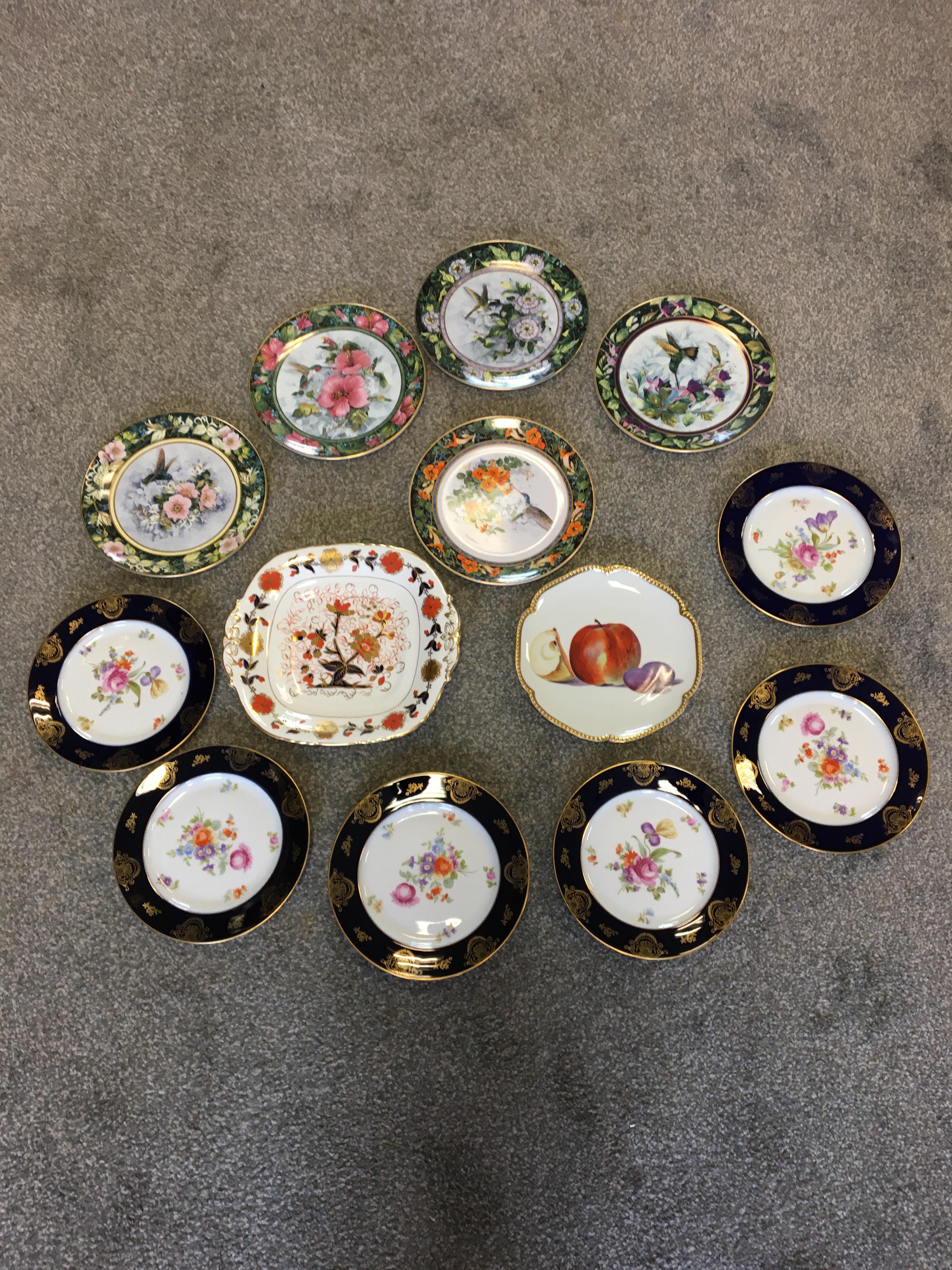 mixed lot of ornate plates to include still life of fruit.
