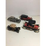 Four Franklin mint fine detail model car models.