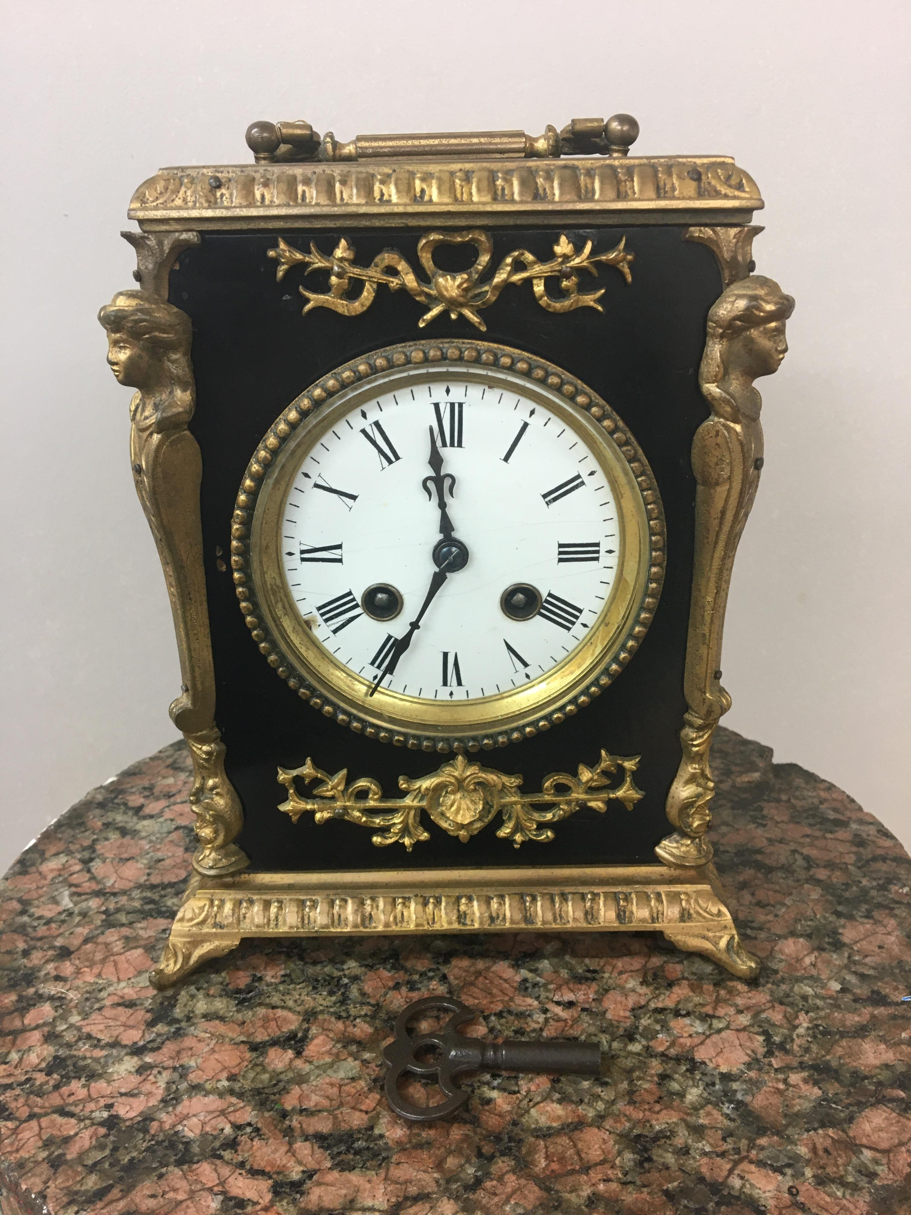 19th c French ebonised and gilt mantle clock, striking on bell. 22cm x 18cm x 13cm.