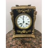 19th c French ebonised and gilt mantle clock, striking on bell. 22cm x 18cm x 13cm.