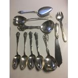 Large silver continental serving spoons in Nouveau