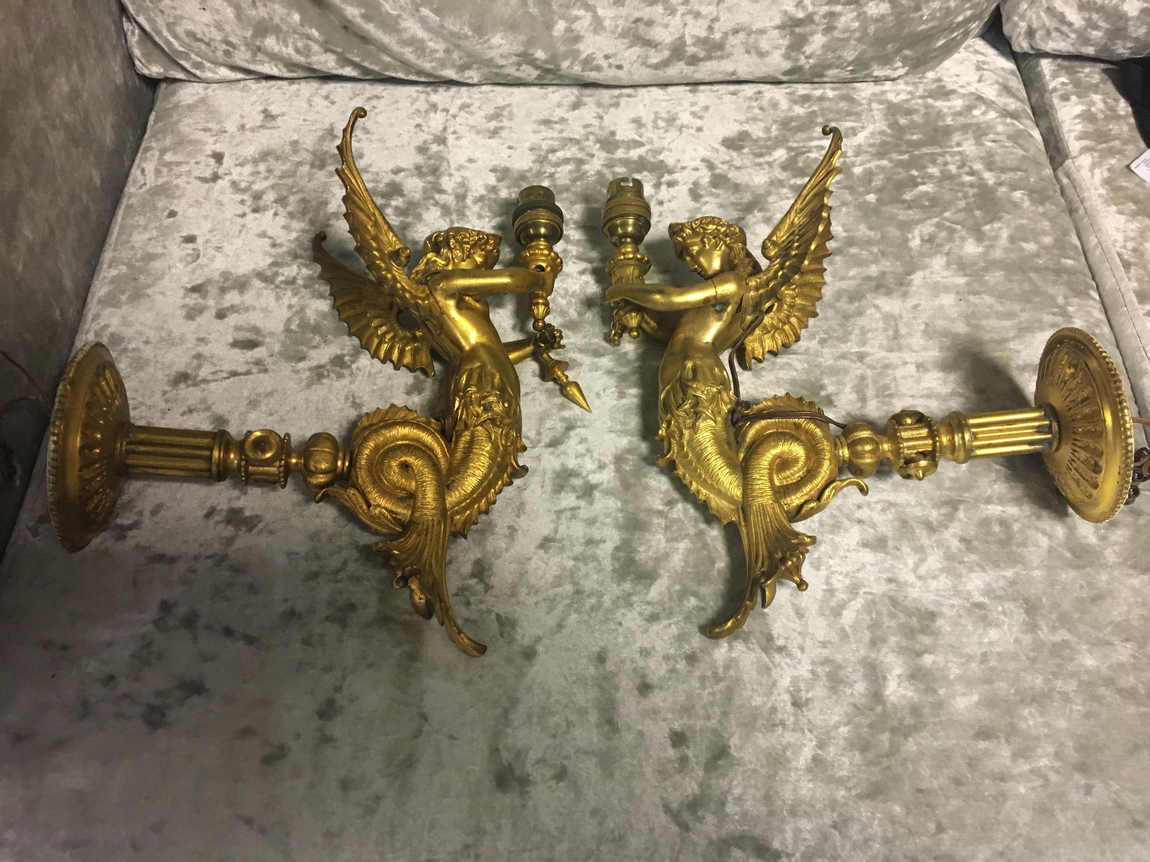 Pair 19th c ormolu gilt winged mythical beast wall lamps.30cm high.