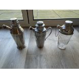 Three spouted cocktail shakers