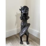Benin bronze of a standing figure blowing a horn 2