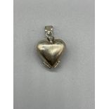 Silver Heart locket, unfolding into a quatrefoil f