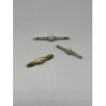 Three gold bar brooches.9G