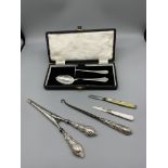 HM Silver cased feeding set, glove stretchers, but