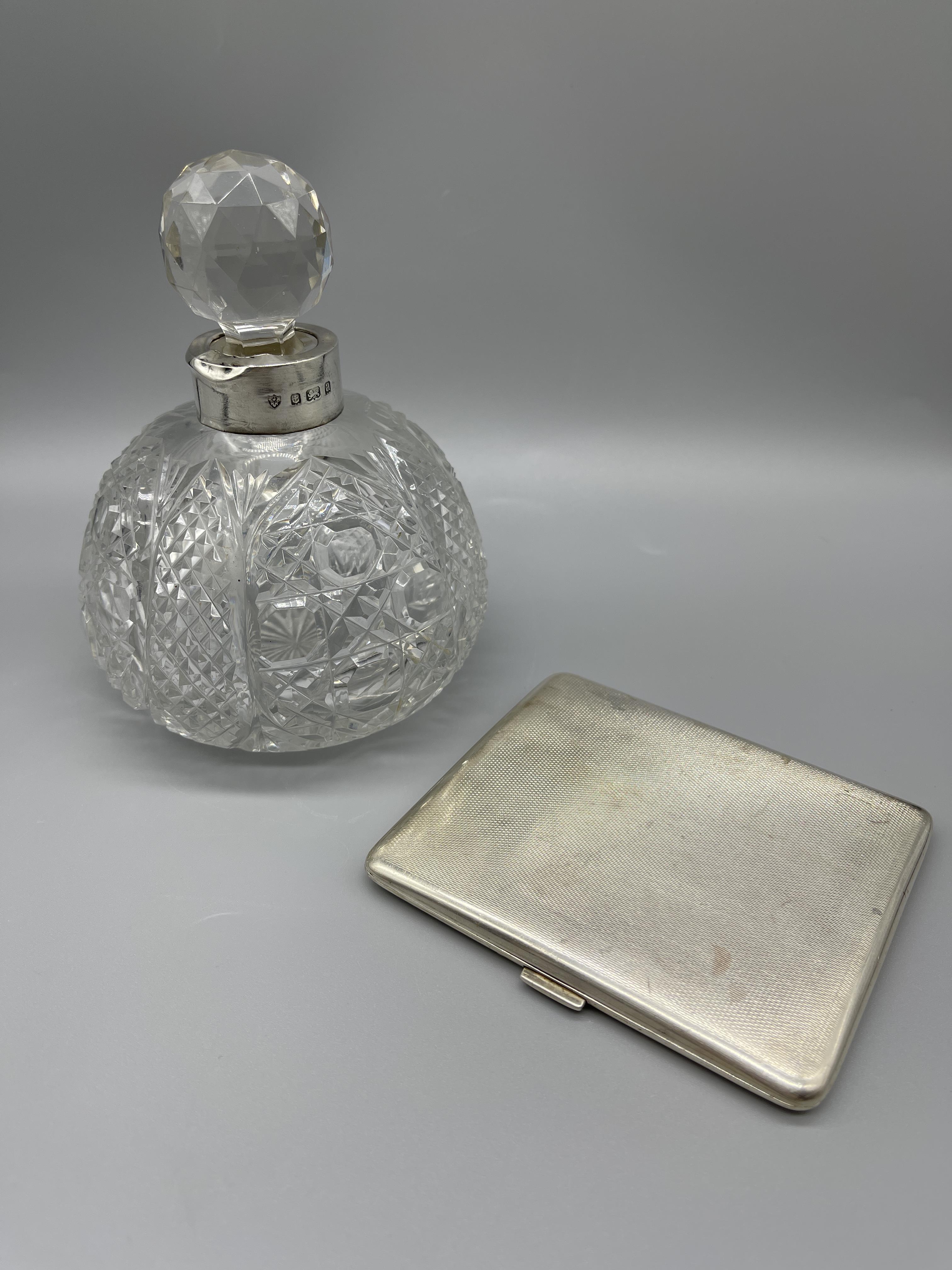 HM Silver cigarette case and Silver necked perfume