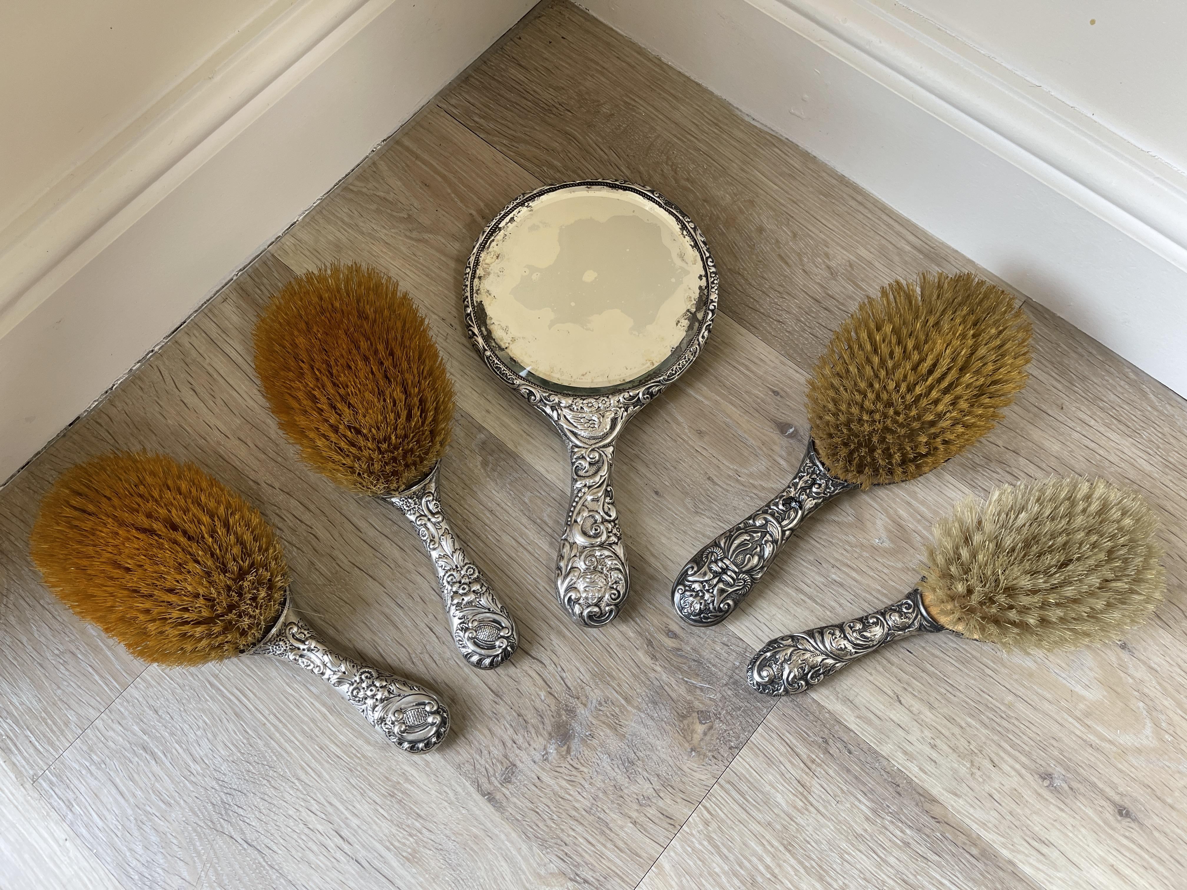 Five piece HM Silver Brush and Mirror set.