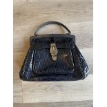 Gucci black patent handbag.with buckle design.