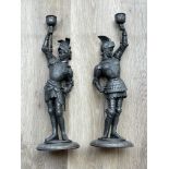 Pair white metal candelabra of knights in armour.