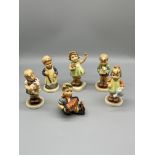 Six Hummel figurines.