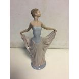 Lladro lady holding dress out. 30 cm H