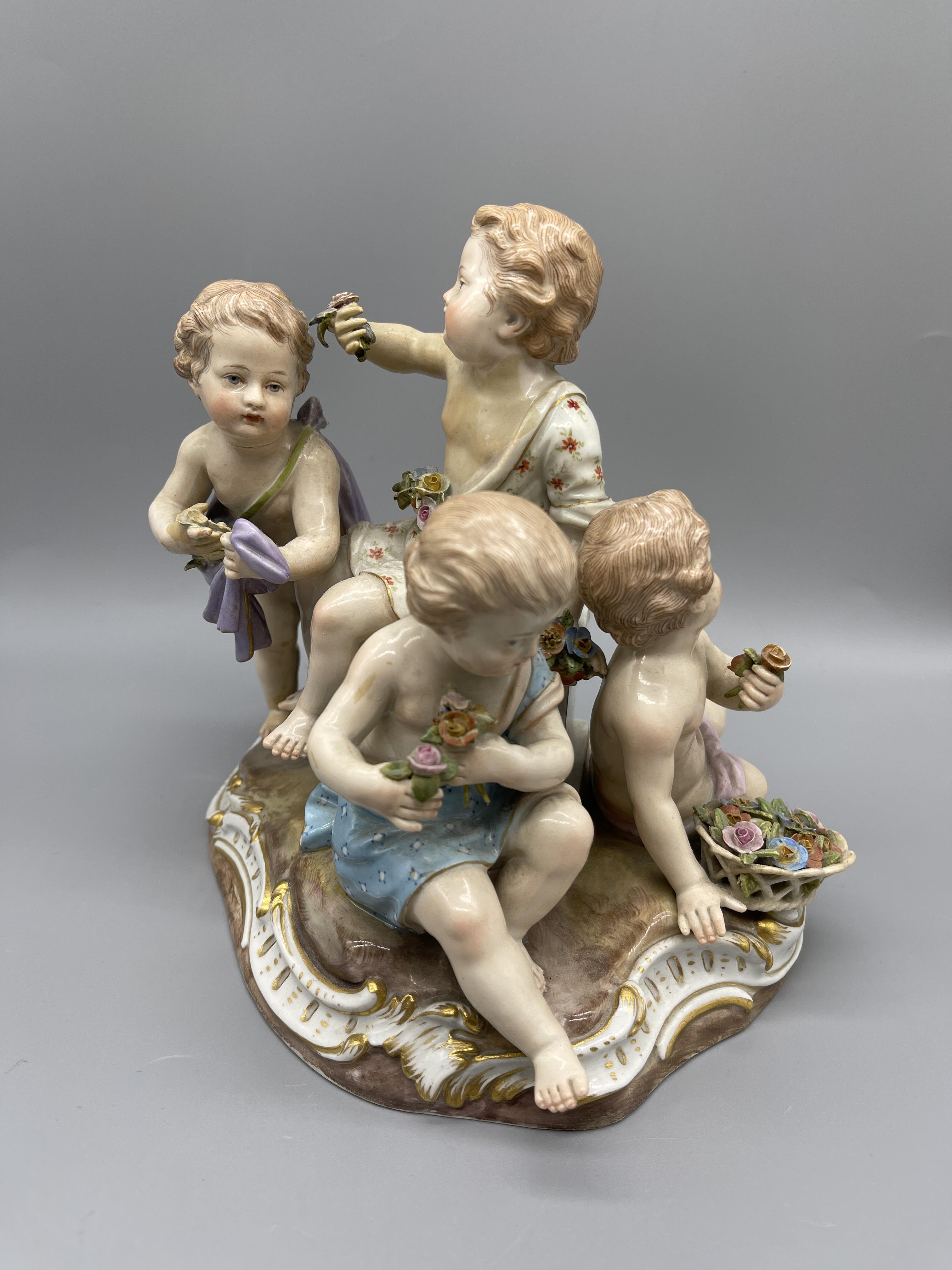 19th C Meissen group of four children holding flow